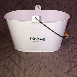 Grove collaborative white metal container with handle.